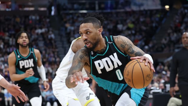 Portland Trail Blazers guard Damian Lillard (0) goes to the basket against the Utah Jazz in the second quarter at Vivint Arena.
